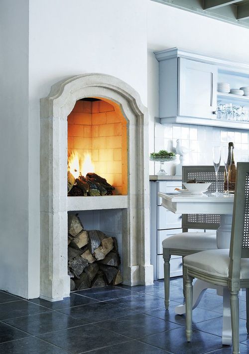 8 Cozy Kitchen Fireplaces via The District Table