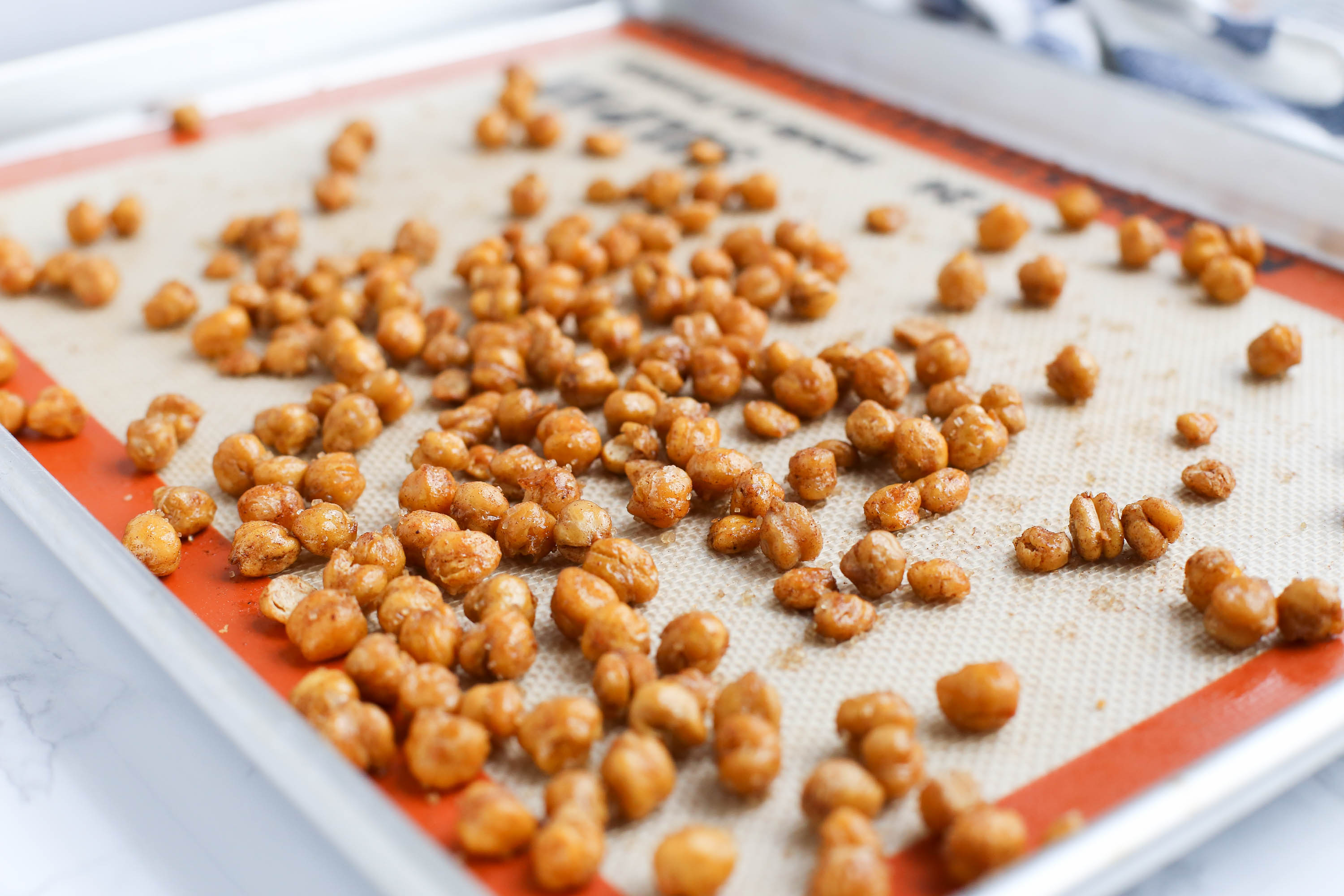 Sweet and Spicy Roasted Chickpeas via The District Table