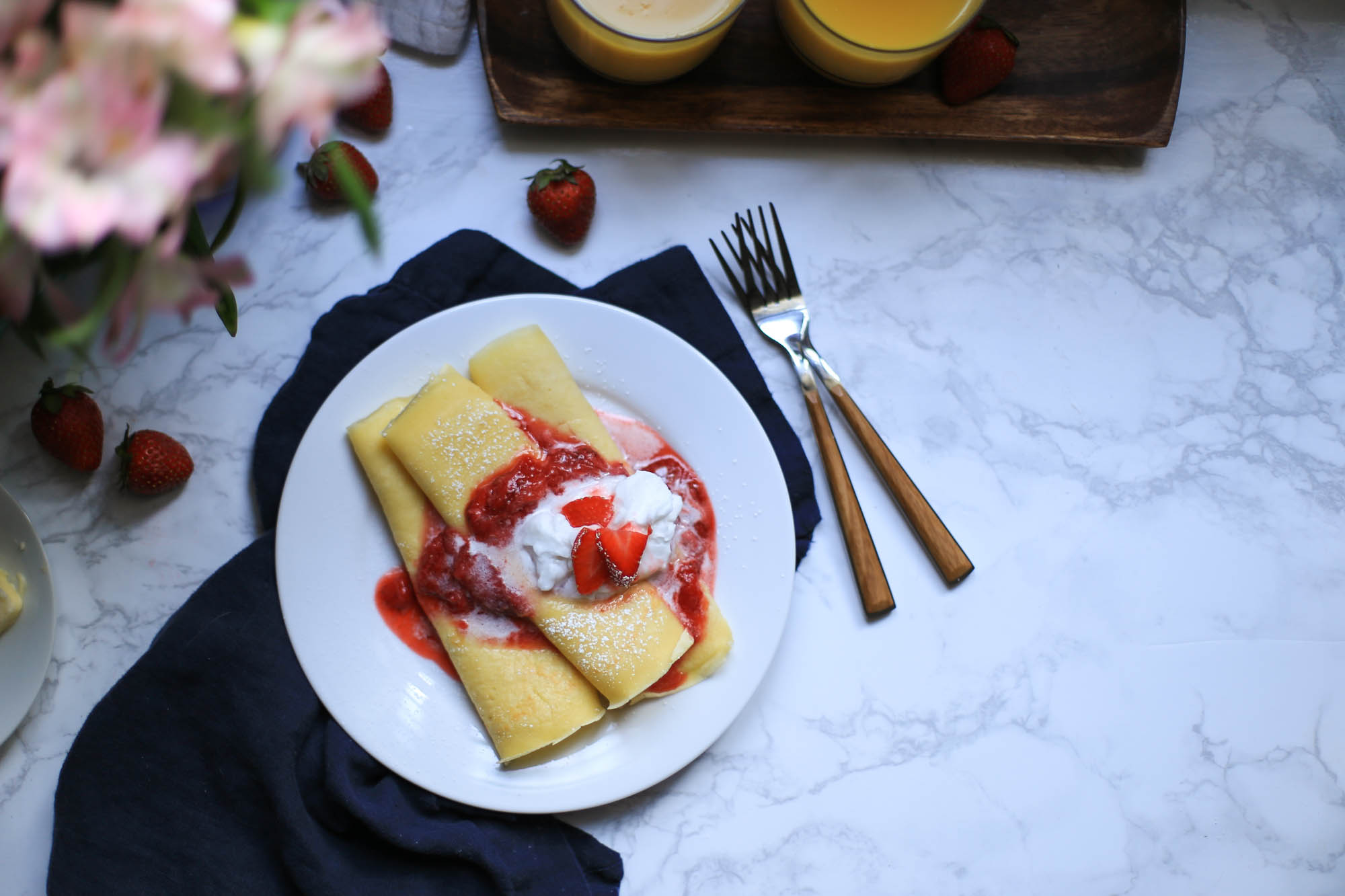 Crepes with Strawberries and Cream by The District Table